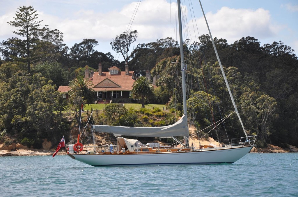 David Champtaloup’s Caprice of Huon, in front of Edron Lodge in Two Fold Bay, Eden, during one of his cruises to Hobart © Mainsheet Media